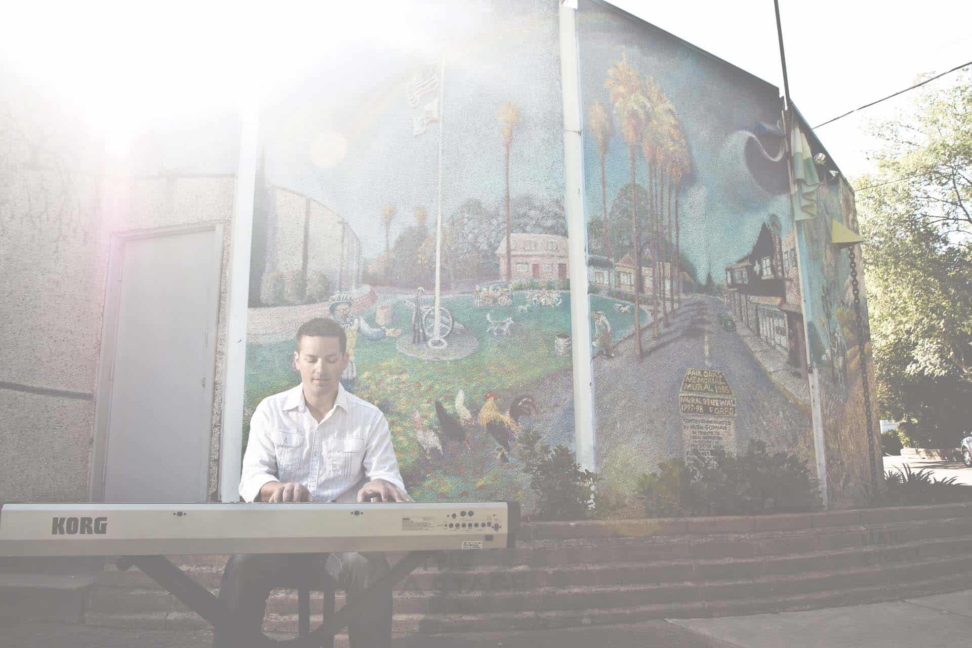 Jamin playing piano outdoors